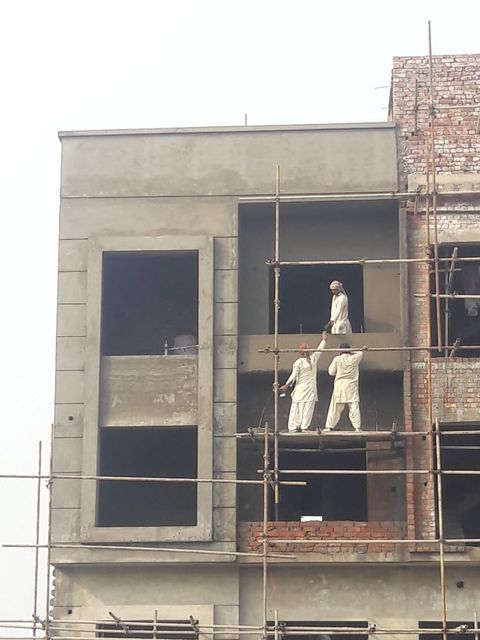 Phase 1 house facade being plastered and finished